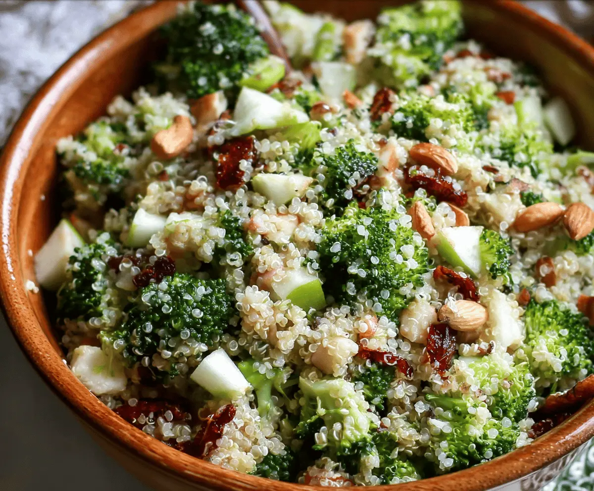 Colorful broccoli, apple, and quinoa salad in a bowl, healthy vegetarian dish with fresh ingredients, perfect for a nutritious meal