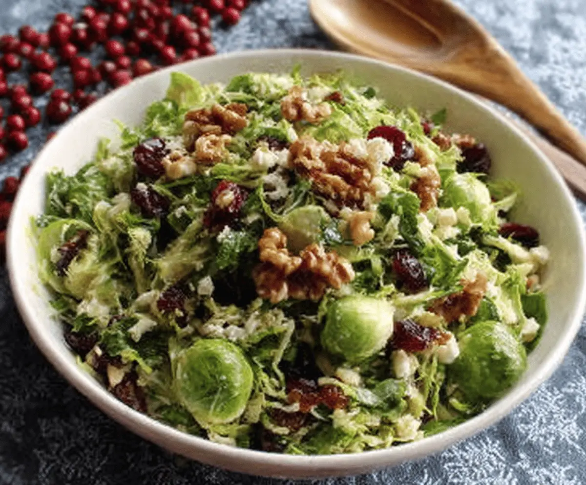 Festive Christmas Brussels Sprout Salad with cranberries and pecans, perfect for holiday meals.