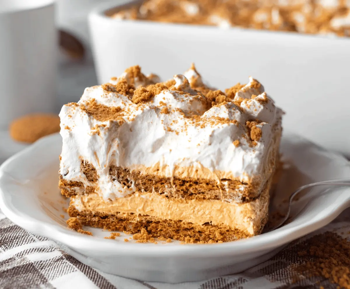 Delicious Gingersnap Pumpkin Icebox Cake layered with creamy pumpkin filling and crispy gingersnap cookies, perfect for fall desserts.