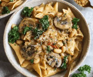 Creamy One-Pot Mushroom and White Bean Pasta served in a bowl, featuring sautéed mushrooms, white beans, and fresh herbs for a hearty vegetarian meal.