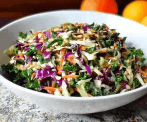 Bright sunflower crunch kale and cabbage salad with fresh vegetables and crunchy toppings, perfect for a healthy and colorful meal.