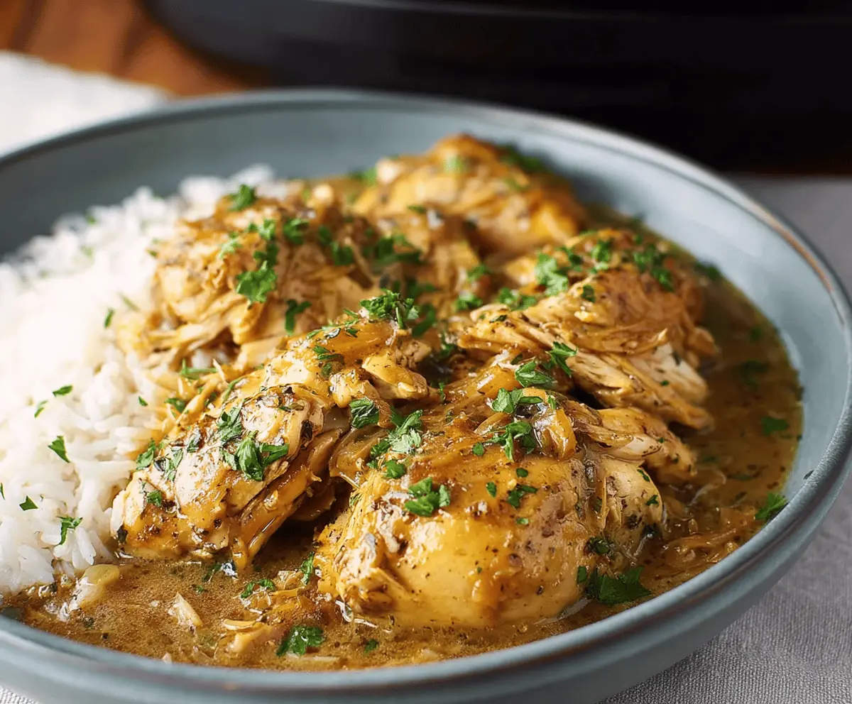 Tender slow cooker chicken topped with rich gravy, perfect for comforting meals