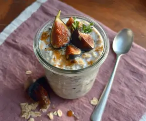 Creamy Coconut Fig Overnight Oats topped with fresh figs and shredded coconut for a healthy breakfast.